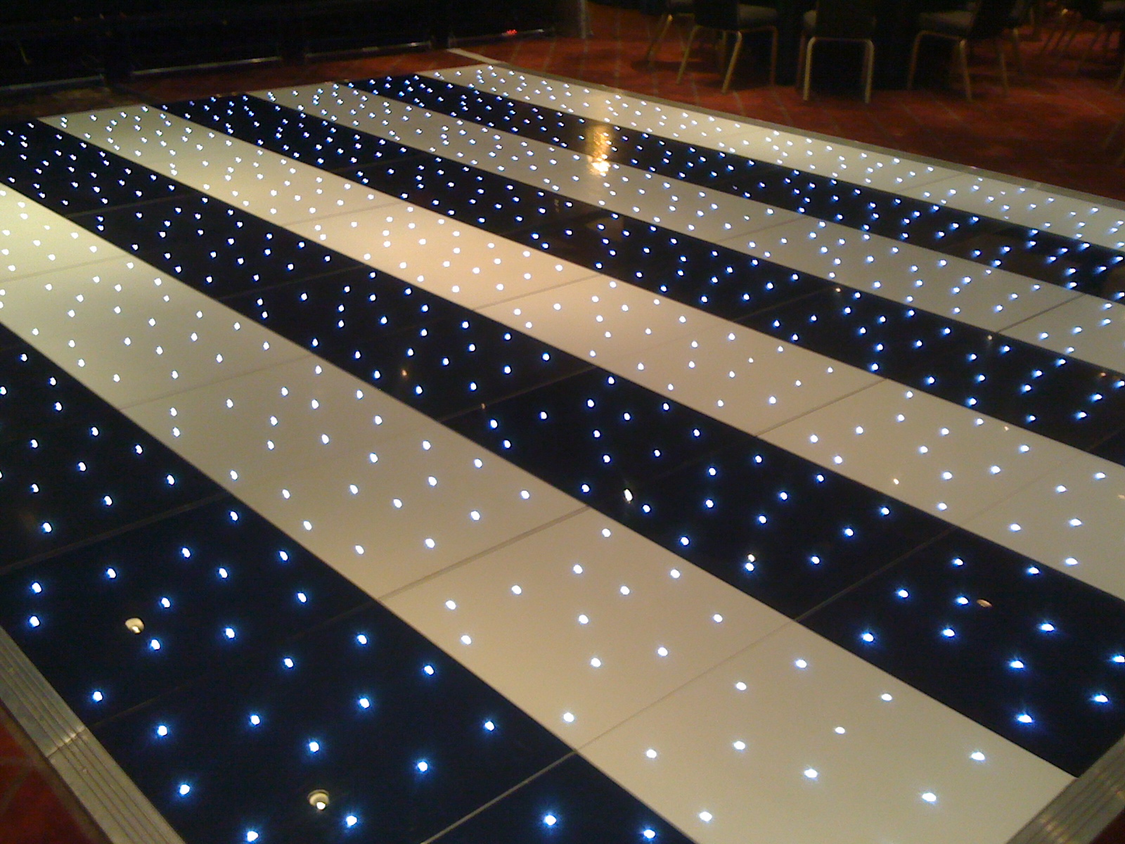 Black and white striped twinkling starlit LED plight dance floors for hire